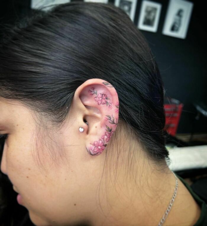 ear tattoo of a pink flower
