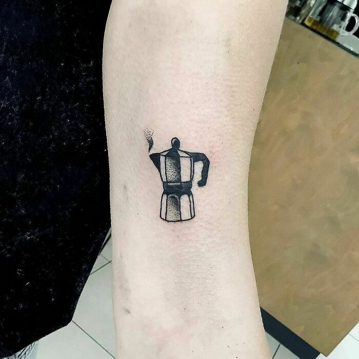minimalistic tattoo of a coffee brewing mug