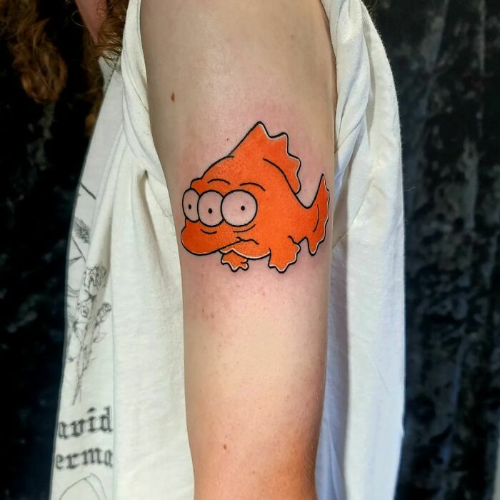 Fish from The Simpsons arm tattoo