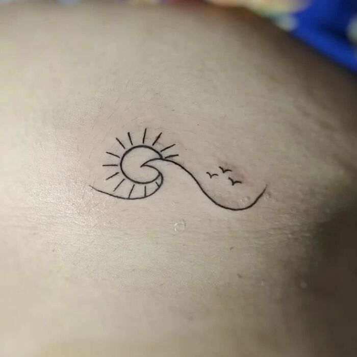 minimalistic tattoo of a beach
