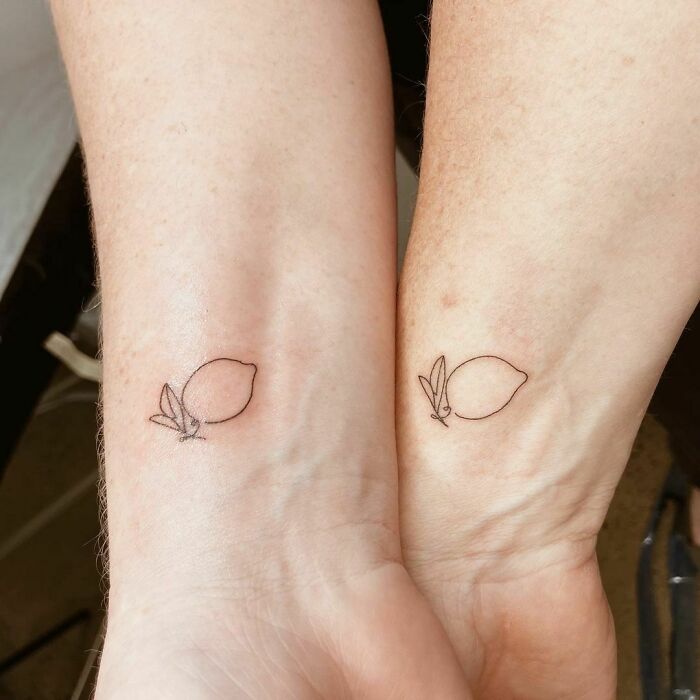 minimalistic tattoo of two lemons