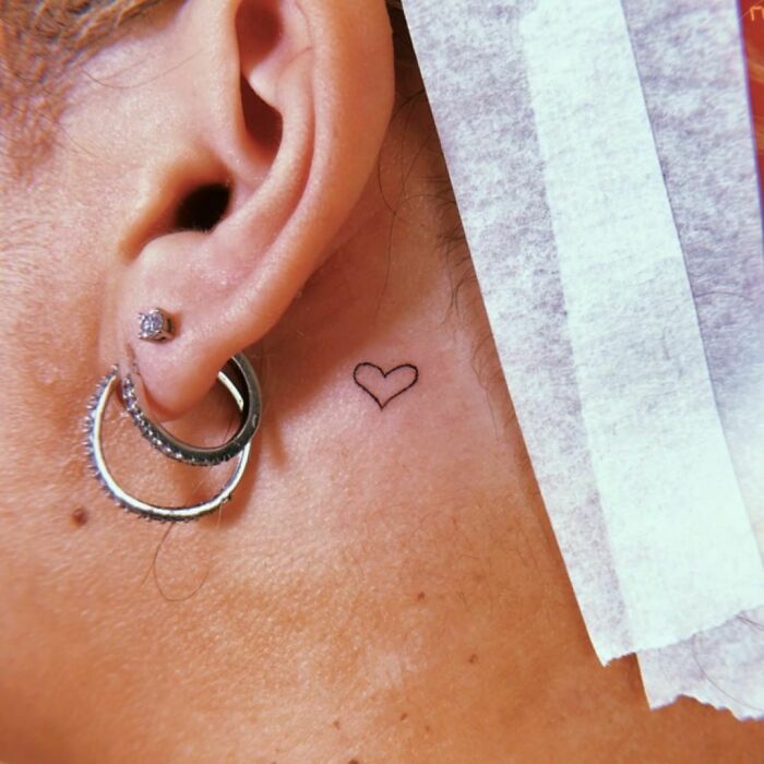 ear tattoo of a simple heart