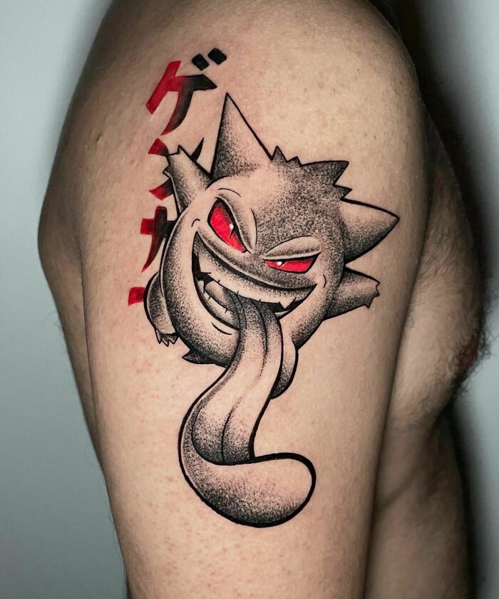 Gengar from Pokémon arm tattoo
