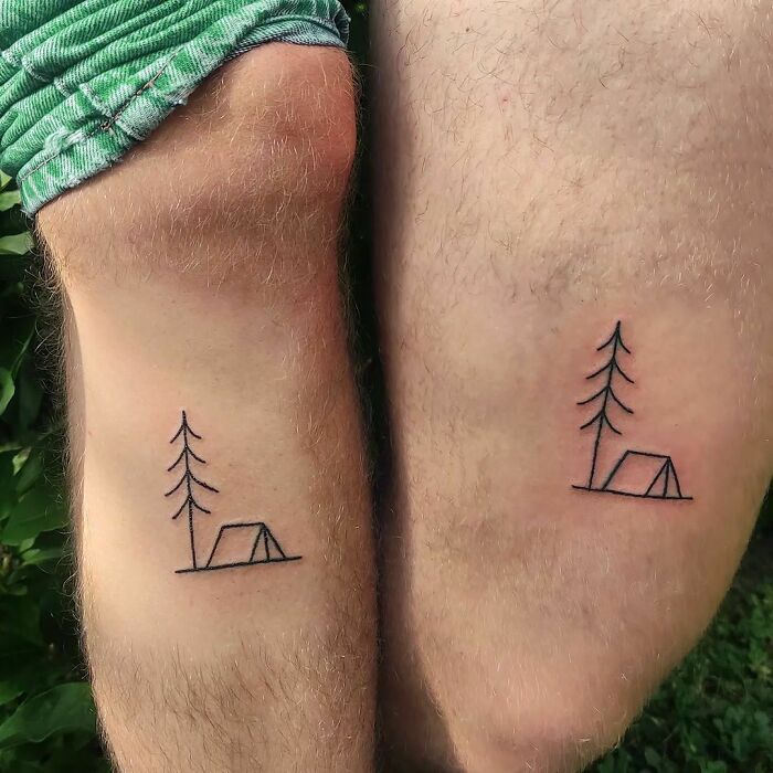 minimalistic tattoo of a camping tent and a tree