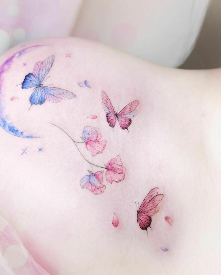 colorful flowers and butterflies tattoo on the chest