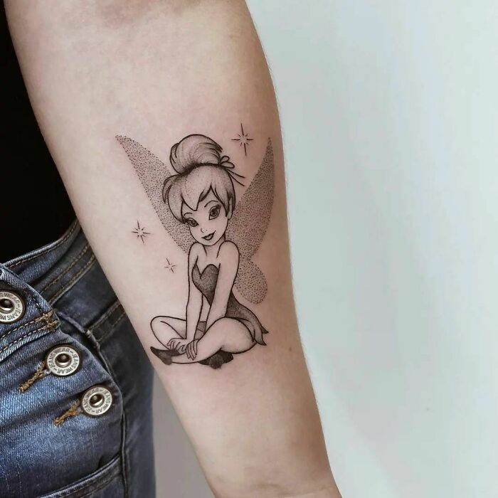 Tinker Bell with crossed legs tattoo 