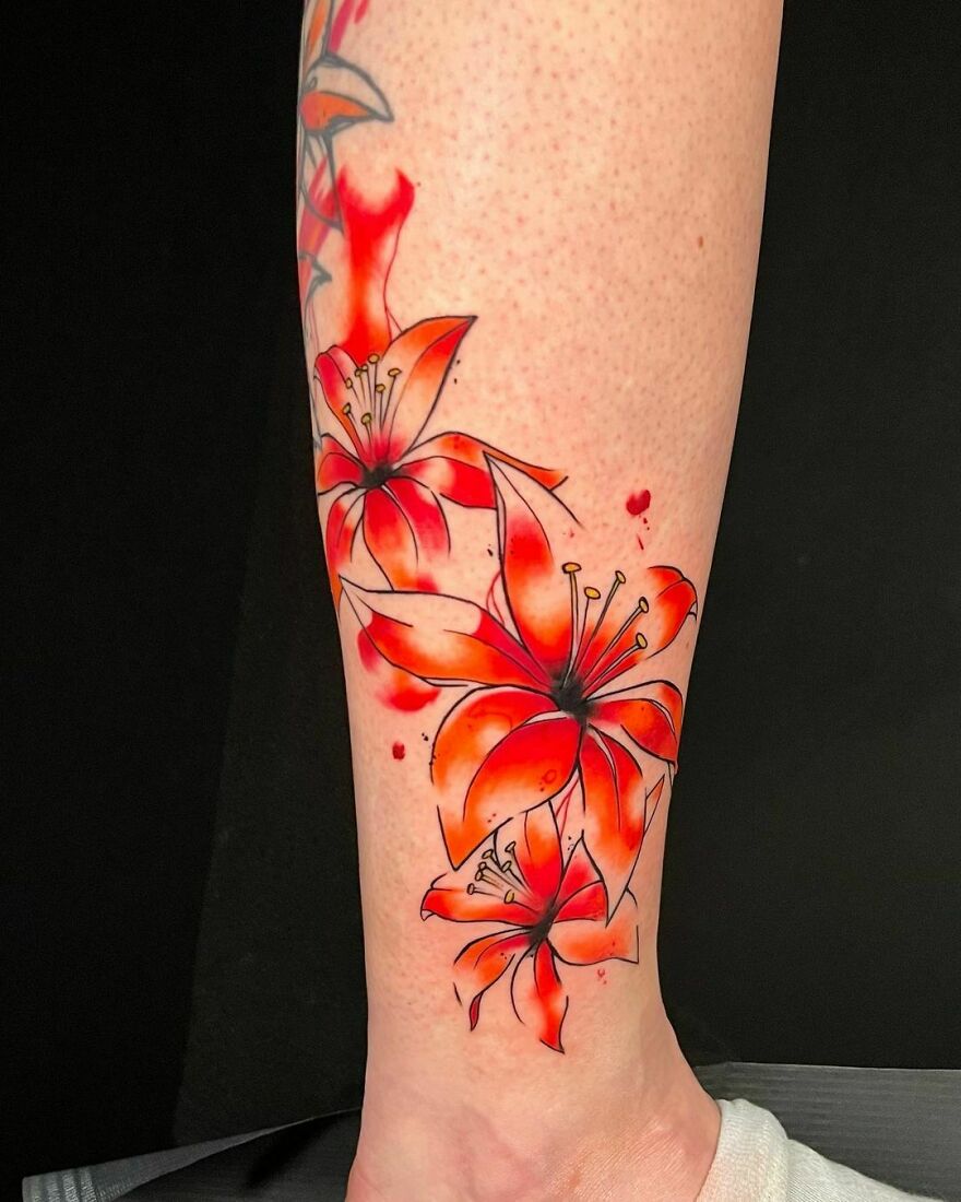 watercolor flowers tattoo on the leg