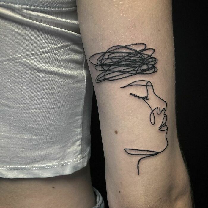 Line woman face back arm tattoo