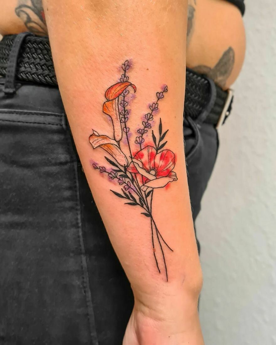 colorful flower tattoo on the forearm