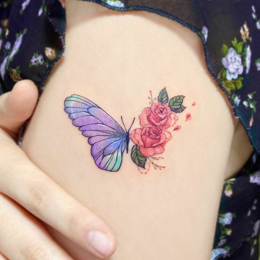 butterfly and flowers tattoo on the arm