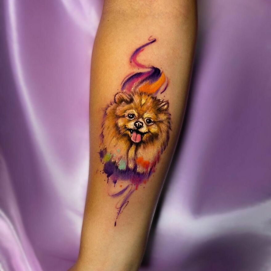 colorful dog tattoo on the forearm
