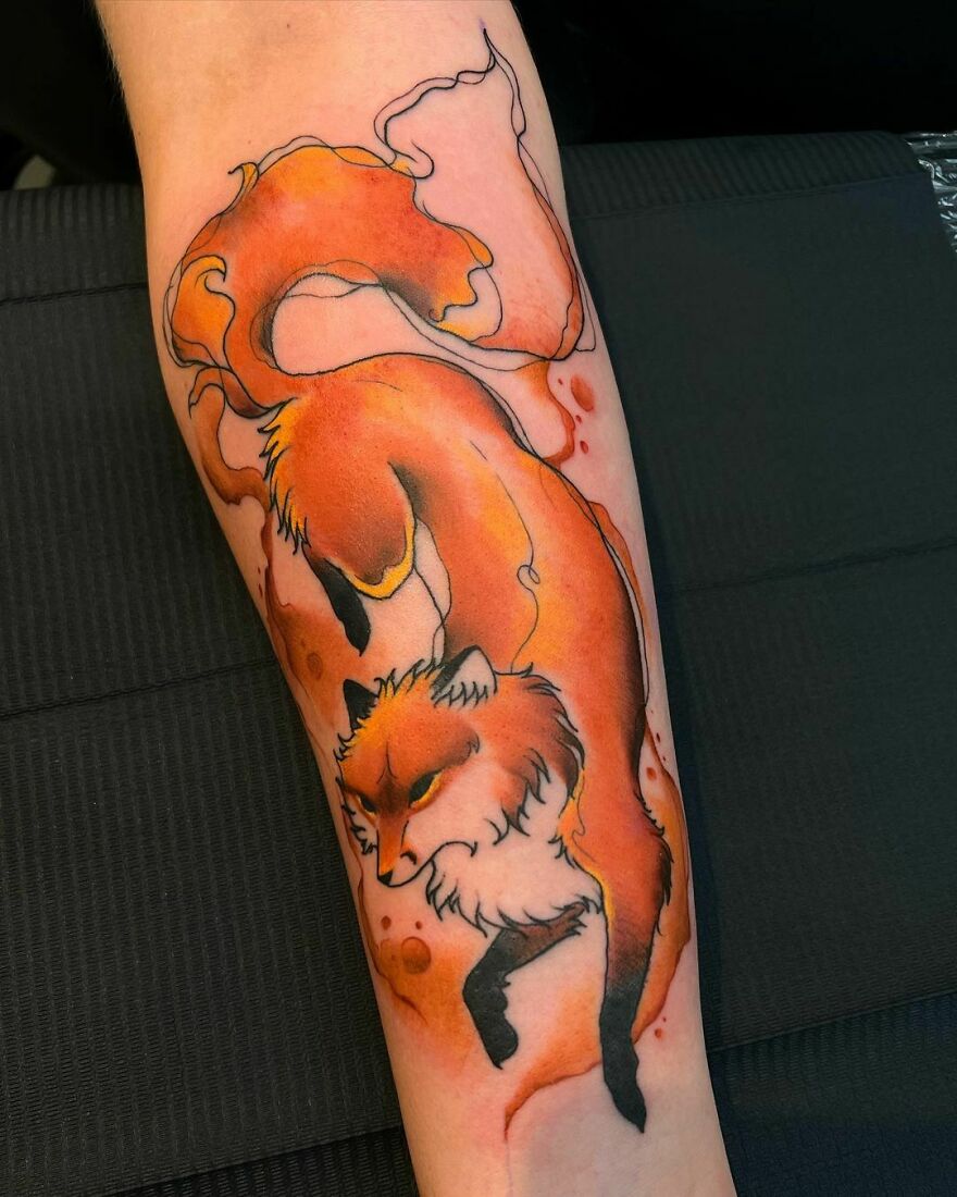red fox tattoo on the arm