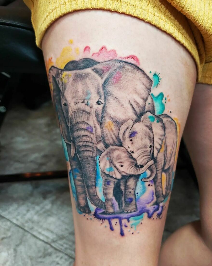 colorful elephant family tattoo on the arm