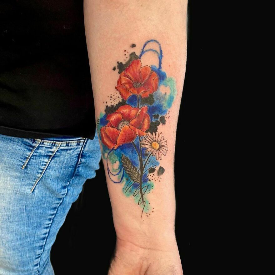 Watercolor flowers tattoo on the forearm