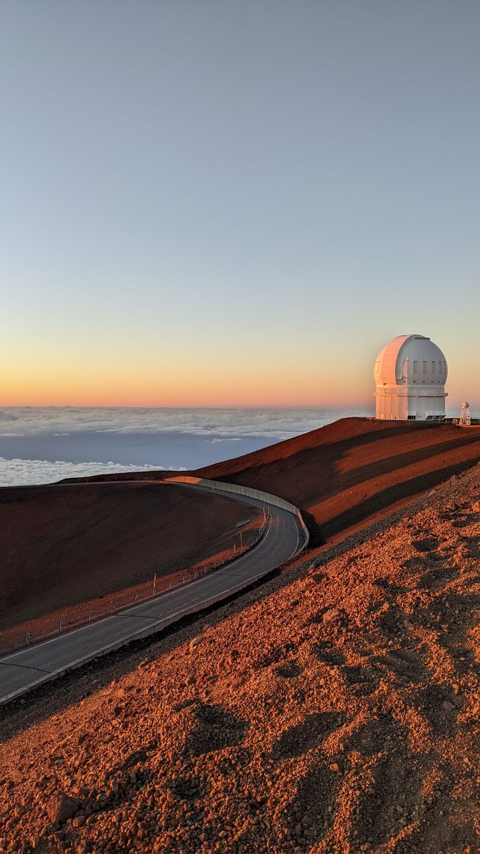 Top Of Mauna Kea Hawaii - A Telescope At Sunset Above The Clouds