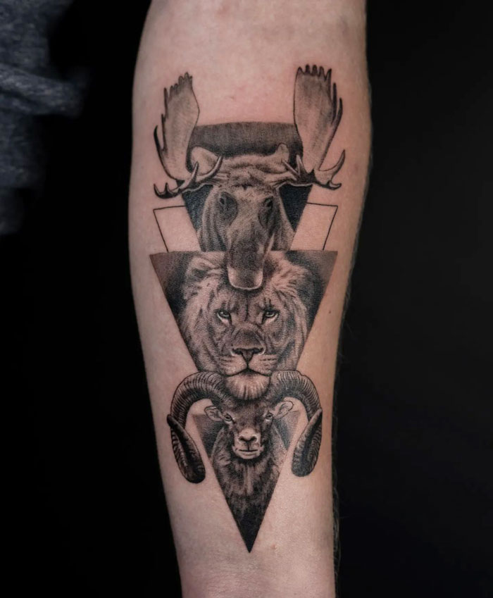 Animal faces and triangles composition tattoo on arm