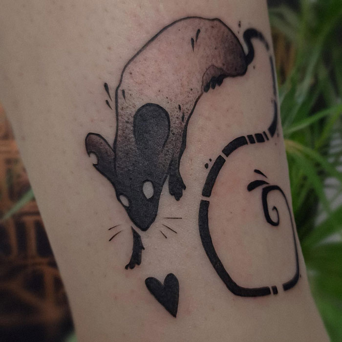 Minimalist animal tattoo featuring a stylized rat with a heart, highlighting unique tattoo idea inspiration.