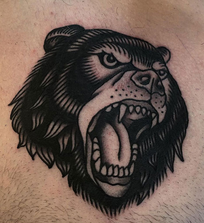 Black roaring bear face tattoo