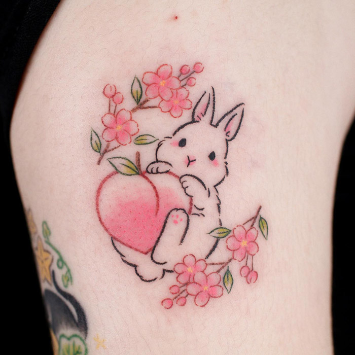 Pink cute peach, rabbit and flowers tattoo