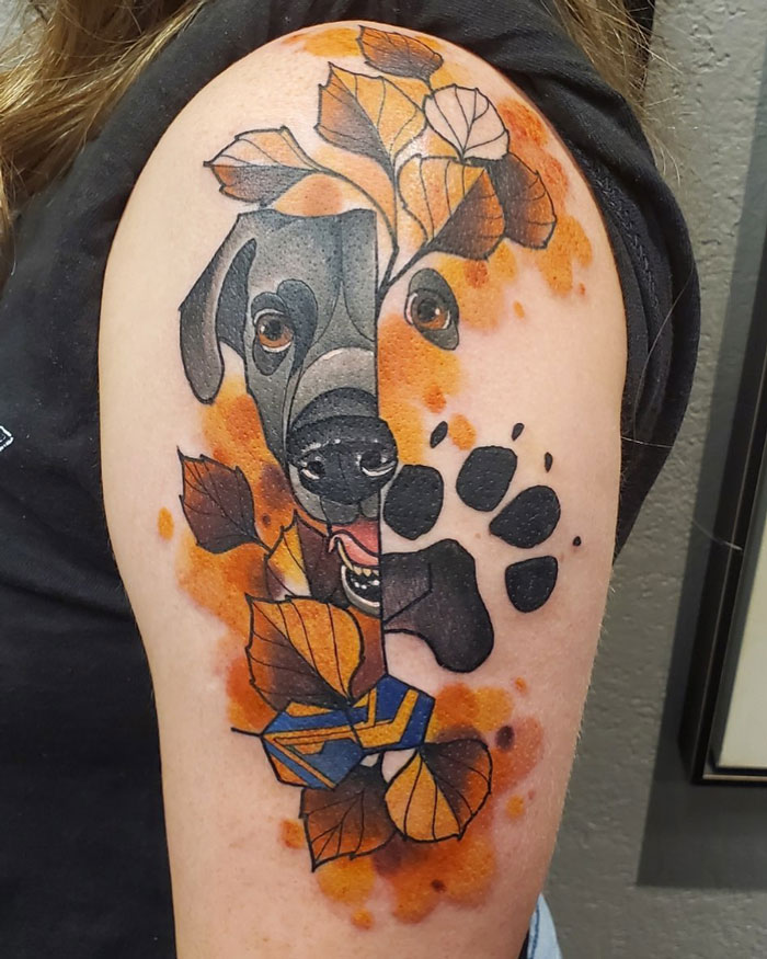 Dog face and yellow tree leaves tattoo