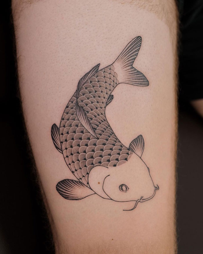 Swimming fish tattoo