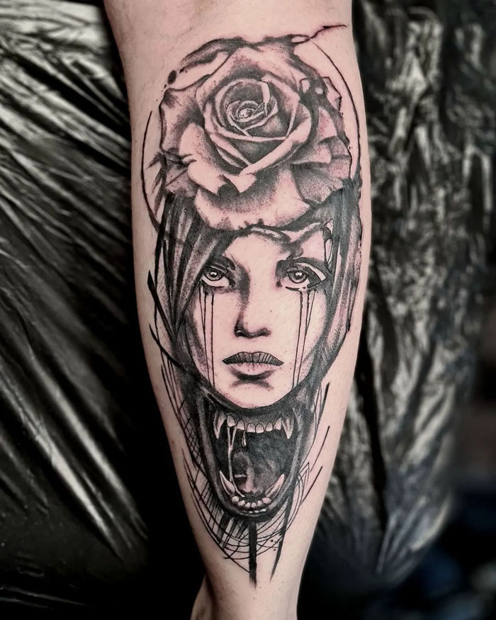 Woman with rose calf tattoo