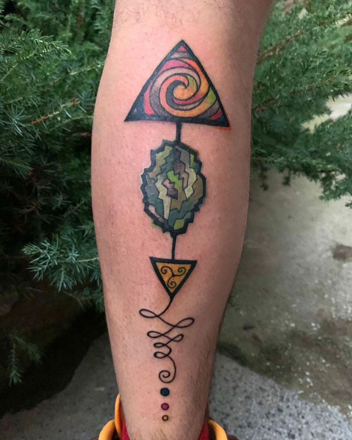 Watercolor Illuminati calf tattoo