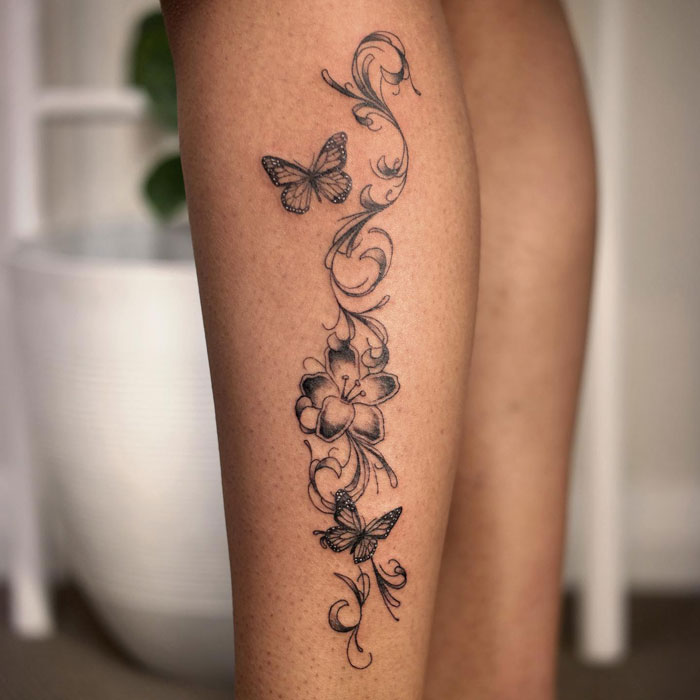 Butterflies and flower calf tattoo