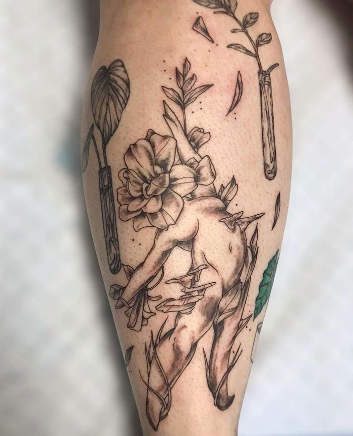 Statue calf tattoo