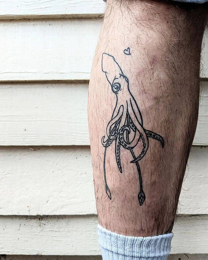 Unique calf tattoo featuring a minimalist squid design, highlighting cool and creative body art ideas.