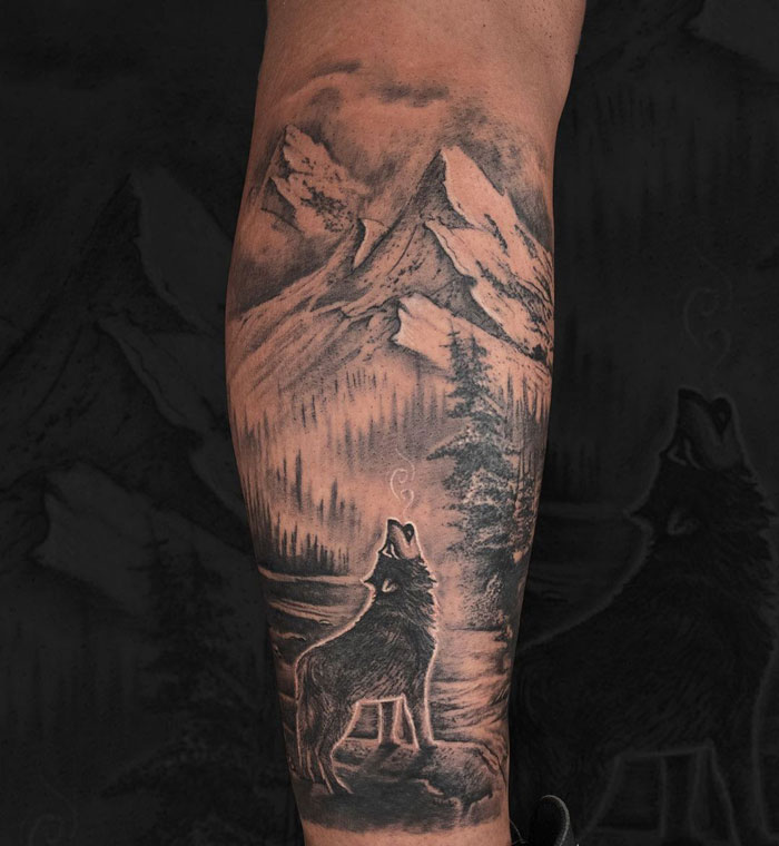 Howling wolf calf tattoo