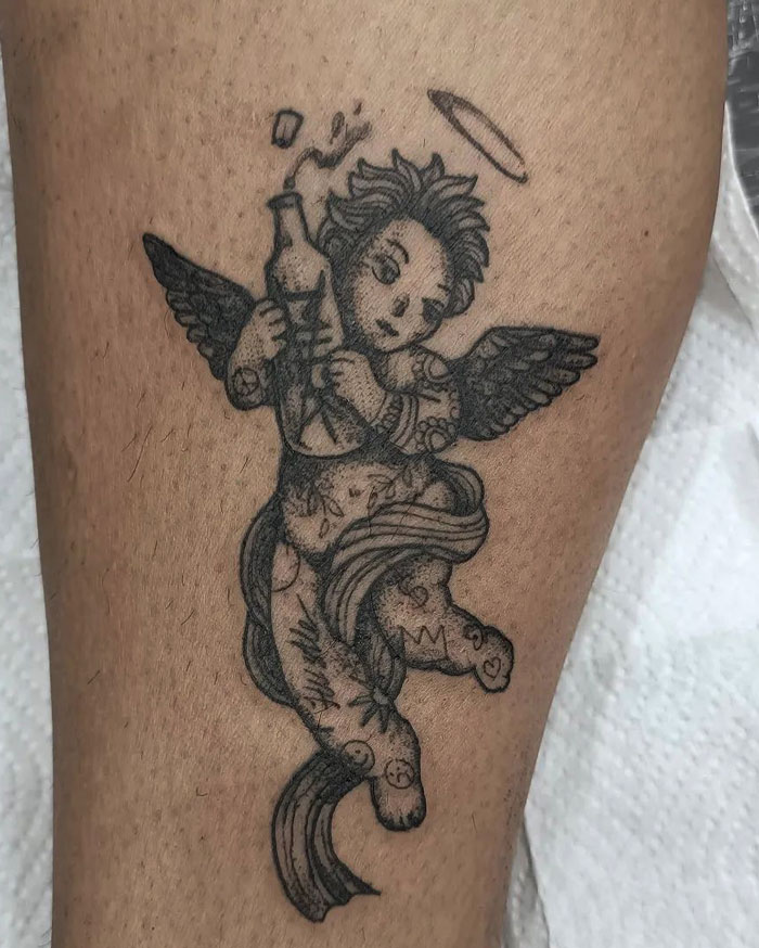 Angel with bottle of milk calf tattoo