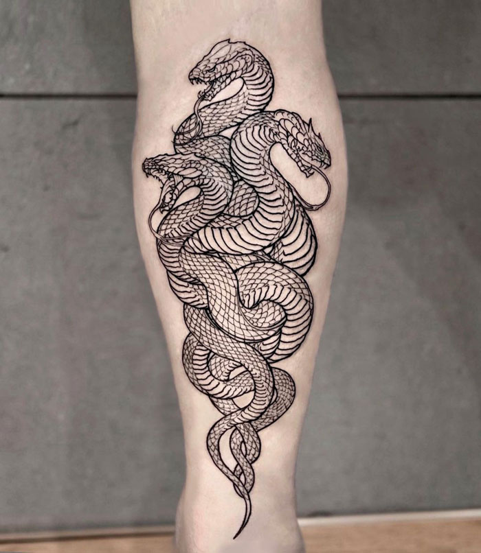 Triple snakes calf tattoo