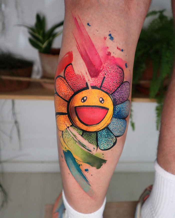 Watercolor flower calf tattoo