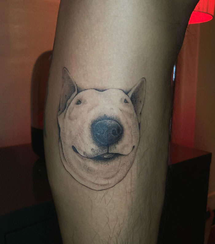 Dog head calf tattoo