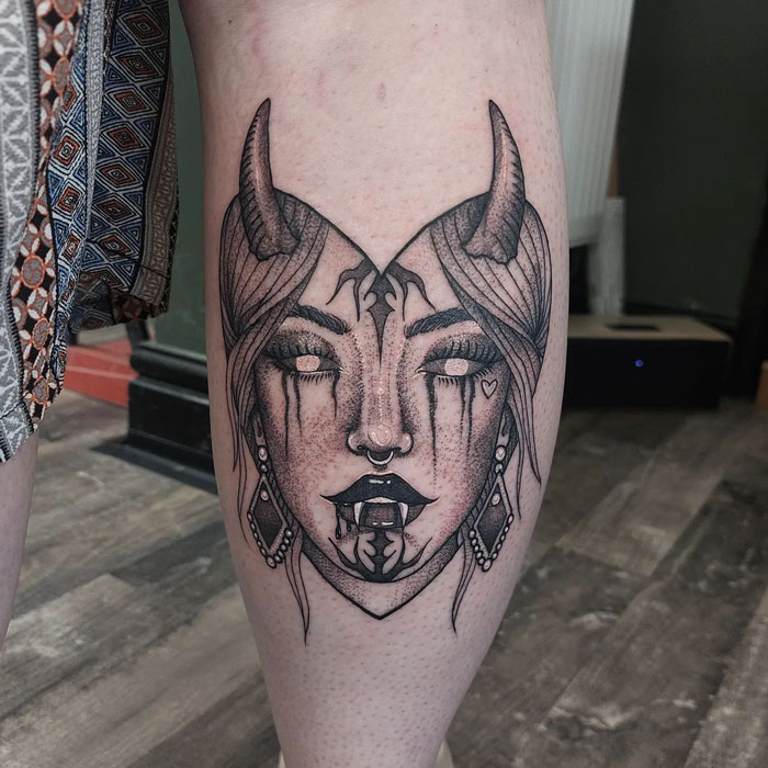 Vampire woman calf tattoo