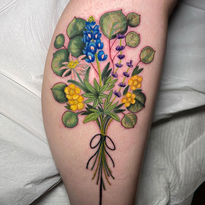 Watercolor plants calf tattoo