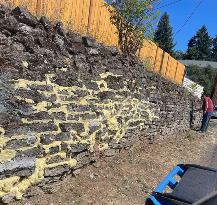 Neighbors Attempting To Reinforce Their Stone Wall With….spray Foam Insulation