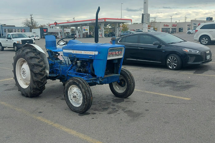 Someone Drove A '70s Ford Tractor To Canadian Tire In The Middle Of The City