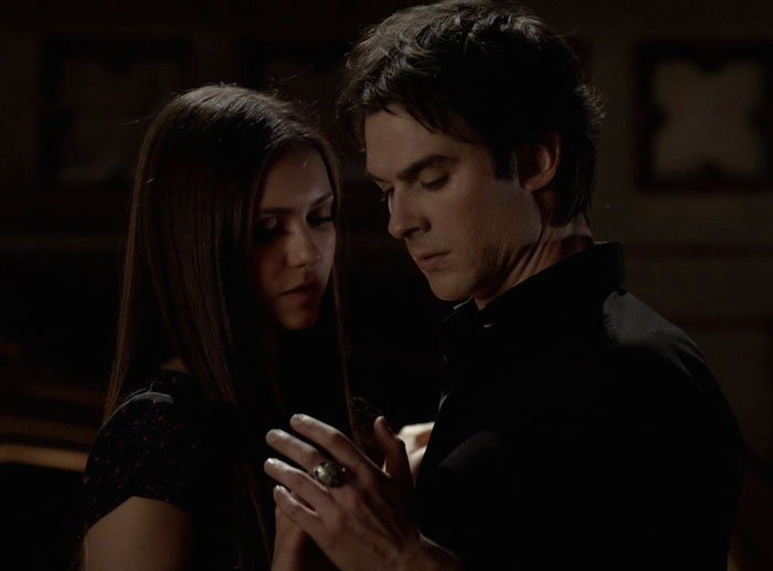 Damon and Elena holding hands