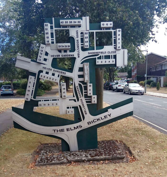A Sign With A Map Of Houses Numbers And Streets