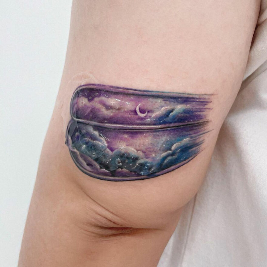 colorful space tattoo on the arm