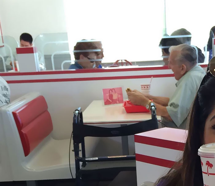 Old Man Eating By Himself At 'In-N-Out' With A Picture Of His Wife