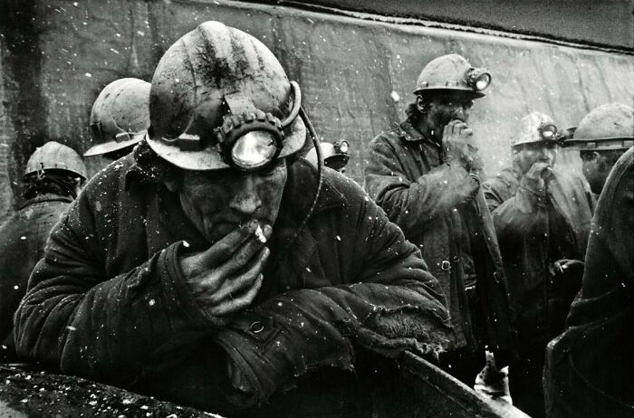 Miners Light Up Reused Cigarettes At The End Of An Eight-Hour Shift Underground At The Zhdanovskaya Coal Mine, All For $30 A Month. Donbass, Ukraine. February 1992 - By Shepard Sherbell