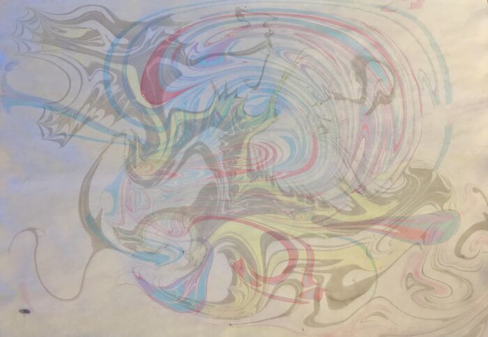 Abstract design with flowing patterns, showcasing a blend of traditional marbling and tattoo design elements.