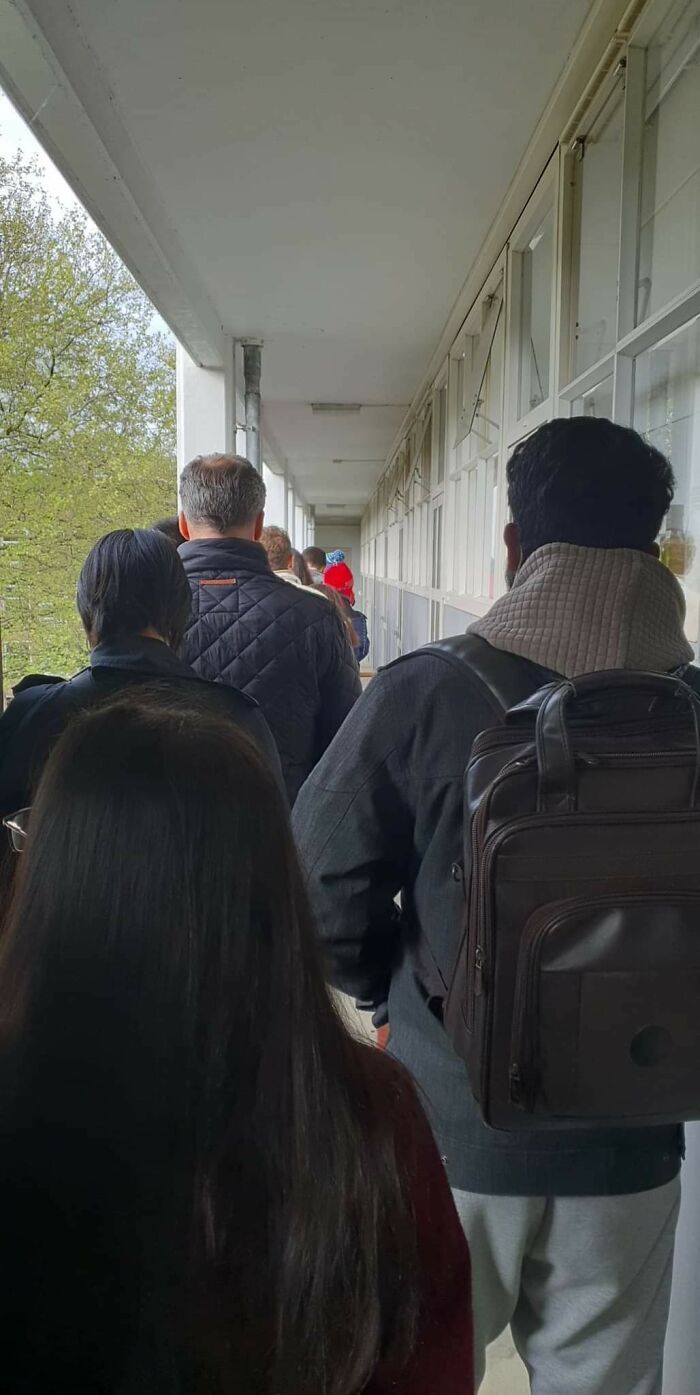 50+ People Waiting In A Queue To Visit A Rental Studio In Amsterdam