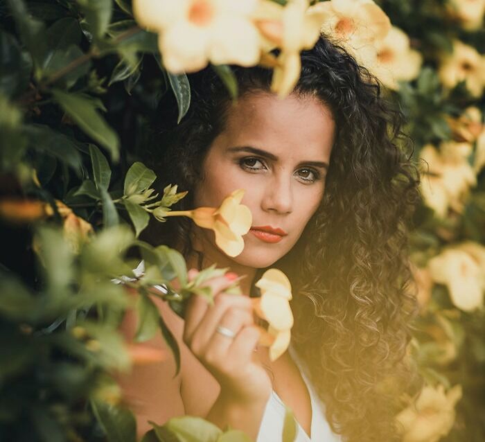 Picture of woman in flowers looking