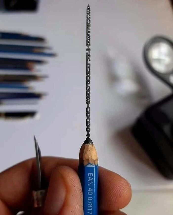 An Entire Alphabet Is Carved Into A Pencil