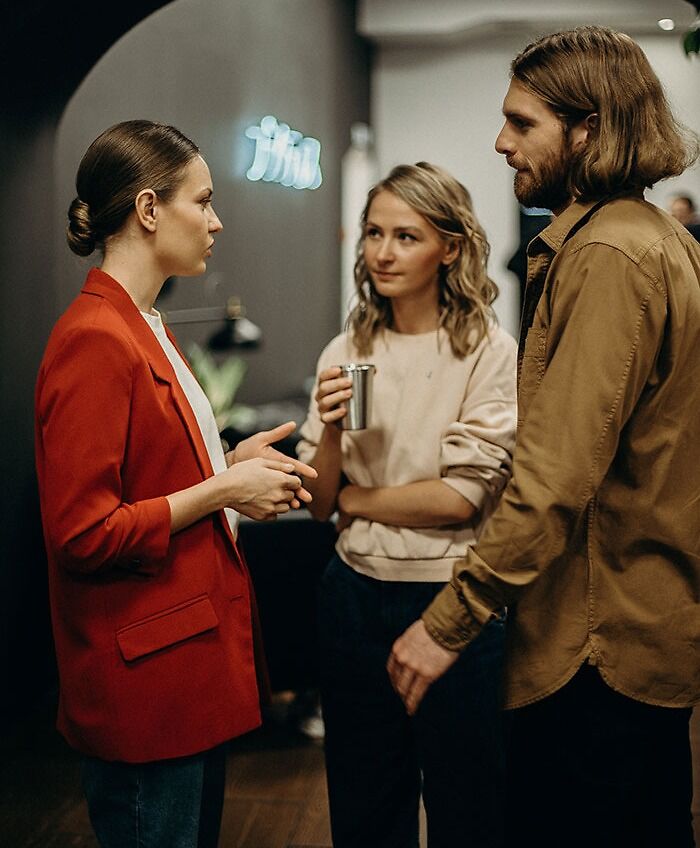 Couple Arguing With A Waitress 