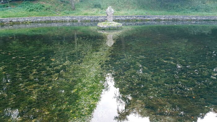 Underwater Path Created By People Walkin Through About 2 Feet Of Water To Get To That Stone At A St Patrick's Well In Ireland